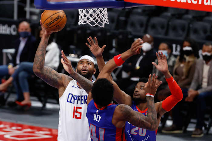 Apr 14, 2021; Detroit, Michigan, USA; LA Clippers center DeMarcus Cousins (15) shoots on Detroit Pistons forward Saddiq Bey (41) and guard Josh Jackson (20) in the second half at Little Caesars Arena. Mandatory Credit: Rick Osentoski-USA TODAY Sports